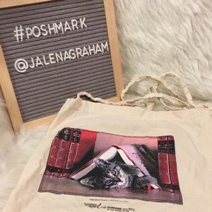 Kitten reading books tote bag humane society